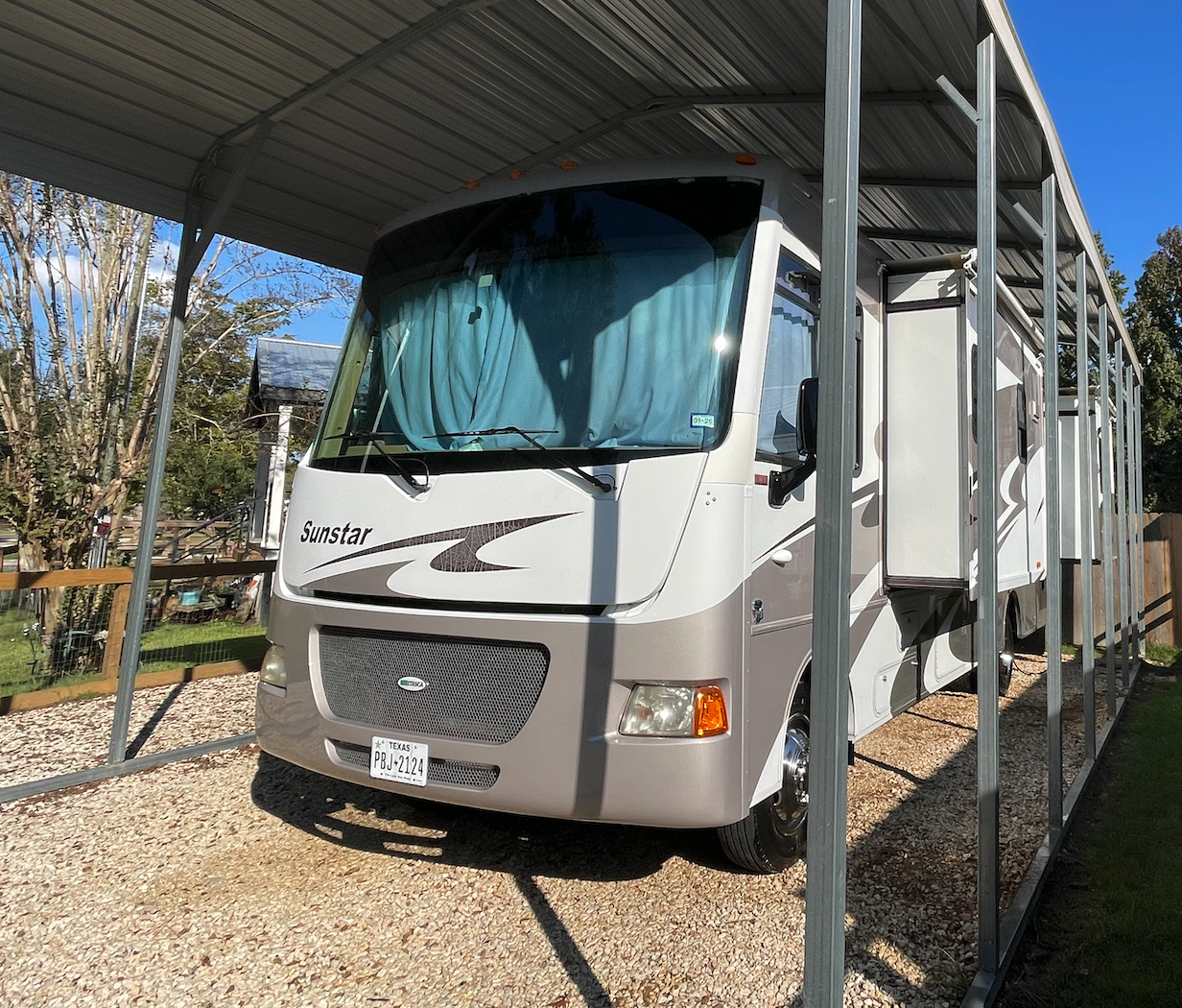 Driver’s side with slides out on 2013 Winnebago Sunstar 30T